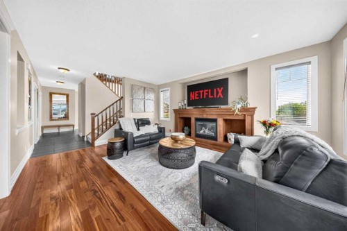 117 Evanspark Circle Nw, Calgary, AB - Indoor Photo Showing Living Room With Fireplace