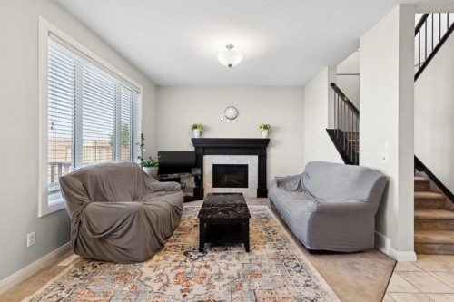 215 Redstone Heights Ne, Calgary, AB - Indoor Photo Showing Living Room With Fireplace