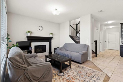 215 Redstone Heights Ne, Calgary, AB - Indoor Photo Showing Living Room With Fireplace