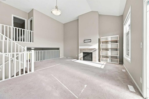142 Yorkstone Way Sw, Calgary, AB - Indoor Photo Showing Other Room With Fireplace