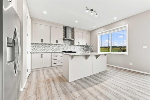 142 Yorkstone Way Sw, Calgary, AB - Indoor Photo Showing Kitchen With Upgraded Kitchen