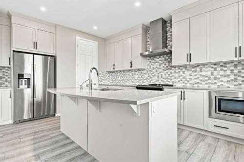 142 Yorkstone Way Sw, Calgary, AB - Indoor Photo Showing Kitchen With Upgraded Kitchen