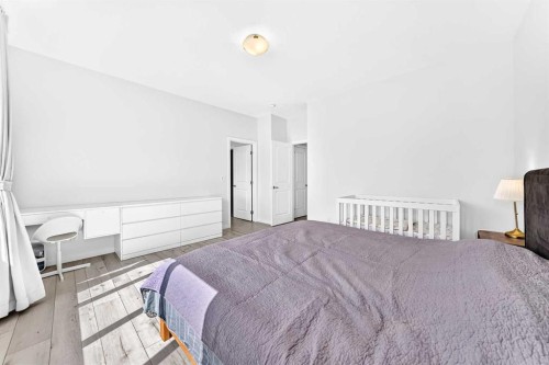 105 Magnolia Manor Se, Calgary, AB - Indoor Photo Showing Bedroom