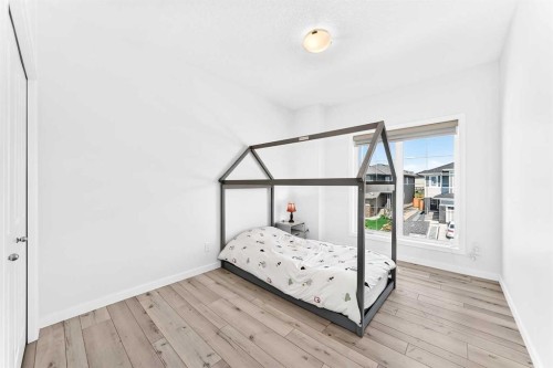 105 Magnolia Manor Se, Calgary, AB - Indoor Photo Showing Bedroom