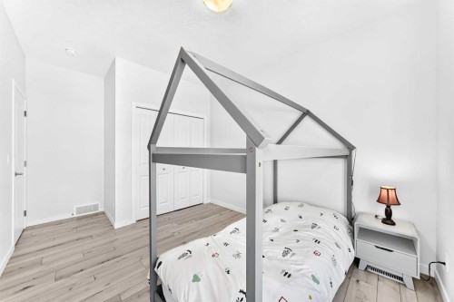 105 Magnolia Manor Se, Calgary, AB - Indoor Photo Showing Bedroom