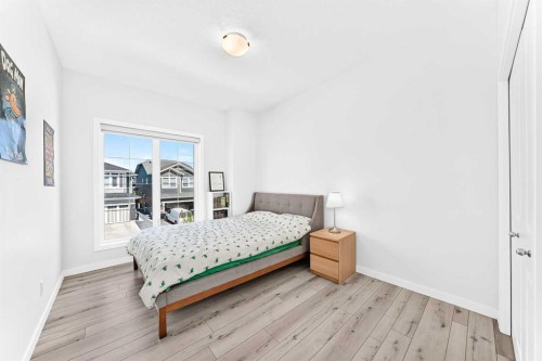 105 Magnolia Manor Se, Calgary, AB - Indoor Photo Showing Bedroom