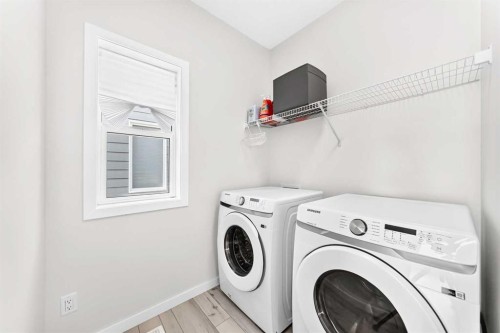 105 Magnolia Manor Se, Calgary, AB - Indoor Photo Showing Laundry Room