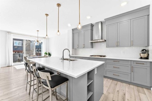 105 Magnolia Manor Se, Calgary, AB - Indoor Photo Showing Kitchen With Upgraded Kitchen