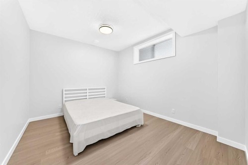 105 Magnolia Manor Se, Calgary, AB - Indoor Photo Showing Bedroom