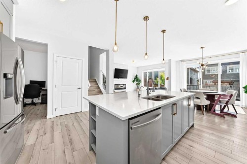 105 Magnolia Manor Se, Calgary, AB - Indoor Photo Showing Kitchen With Double Sink With Upgraded Kitchen