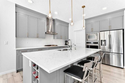 105 Magnolia Manor Se, Calgary, AB - Indoor Photo Showing Kitchen With Upgraded Kitchen
