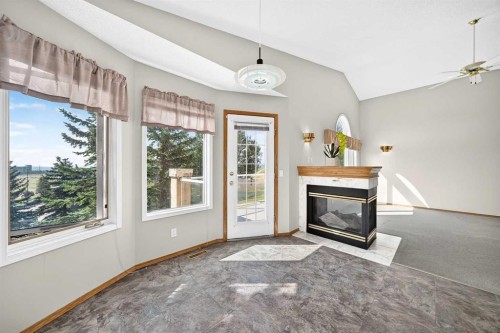 2917 Signal Hill Heights Sw, Calgary, AB - Indoor Photo Showing Living Room With Fireplace