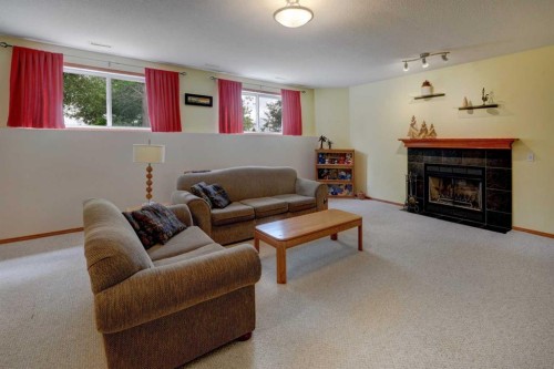 123 Hillview Road, Strathmore, AB - Indoor Photo Showing Living Room With Fireplace