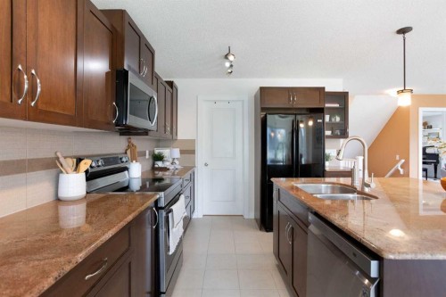 2 Kingston View Se, Airdrie, AB - Indoor Photo Showing Kitchen With Double Sink With Upgraded Kitchen