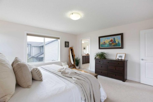 2 Kingston View Se, Airdrie, AB - Indoor Photo Showing Bedroom