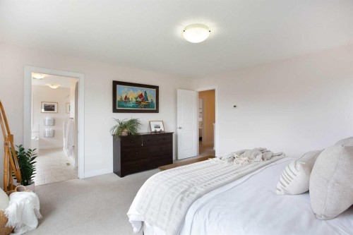 2 Kingston View Se, Airdrie, AB - Indoor Photo Showing Bedroom