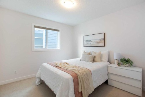 2 Kingston View Se, Airdrie, AB - Indoor Photo Showing Bedroom