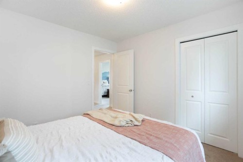 2 Kingston View Se, Airdrie, AB - Indoor Photo Showing Bedroom