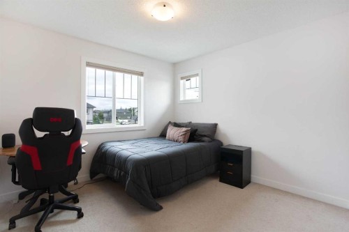 2 Kingston View Se, Airdrie, AB - Indoor Photo Showing Bedroom