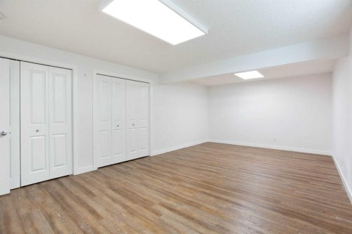 2 Kingston View Se, Airdrie, AB - Indoor Photo Showing Other Room