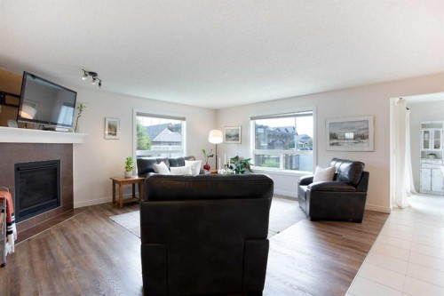 2 Kingston View Se, Airdrie, AB - Indoor Photo Showing Living Room With Fireplace