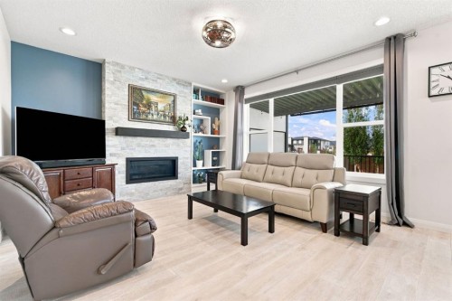 218 Boulder Creek Place, Langdon, AB - Indoor Photo Showing Living Room With Fireplace