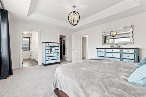 218 Boulder Creek Place, Langdon, AB - Indoor Photo Showing Bedroom