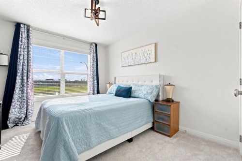 218 Boulder Creek Place, Langdon, AB - Indoor Photo Showing Bedroom