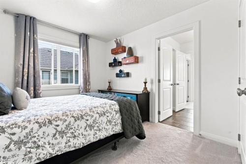 218 Boulder Creek Place, Langdon, AB - Indoor Photo Showing Bedroom