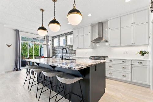 218 Boulder Creek Place, Langdon, AB - Indoor Photo Showing Kitchen With Upgraded Kitchen