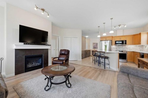 14 Evercreek Bluffs Place Sw, Calgary, AB - Indoor Photo Showing Living Room With Fireplace