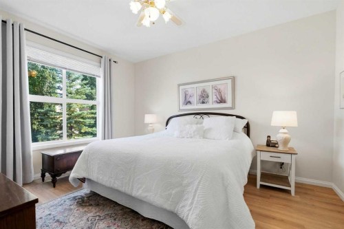 14 Evercreek Bluffs Place Sw, Calgary, AB - Indoor Photo Showing Bedroom