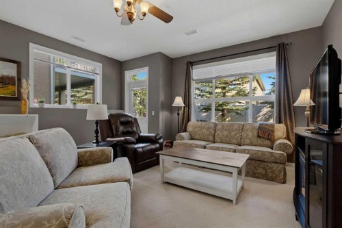 14 Evercreek Bluffs Place Sw, Calgary, AB - Indoor Photo Showing Living Room