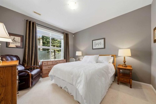 14 Evercreek Bluffs Place Sw, Calgary, AB - Indoor Photo Showing Bedroom