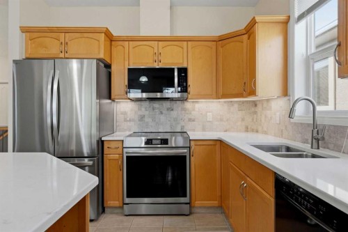 14 Evercreek Bluffs Place Sw, Calgary, AB - Indoor Photo Showing Kitchen With Double Sink