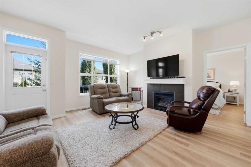 14 Evercreek Bluffs Place Sw, Calgary, AB - Indoor Photo Showing Living Room With Fireplace