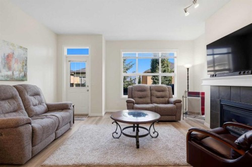 14 Evercreek Bluffs Place Sw, Calgary, AB - Indoor Photo Showing Living Room With Fireplace