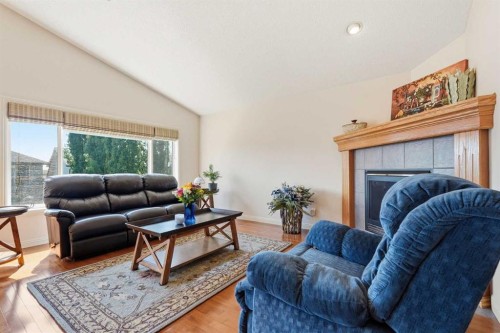 128 Covehaven Gardens Ne, Calgary, AB - Indoor Photo Showing Living Room With Fireplace