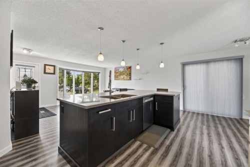 8035 Huntwick Crescent Ne, Calgary, AB - Indoor Photo Showing Kitchen With Double Sink