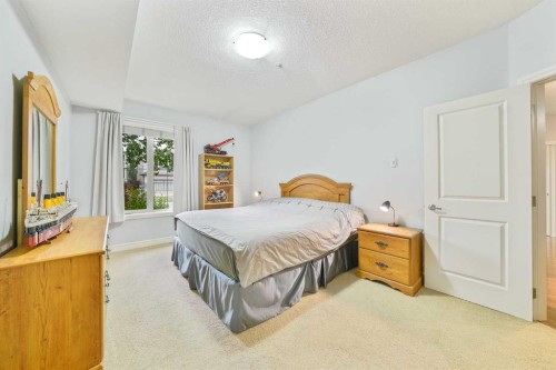 3104-15 Sunset Square, Cochrane, AB - Indoor Photo Showing Bedroom