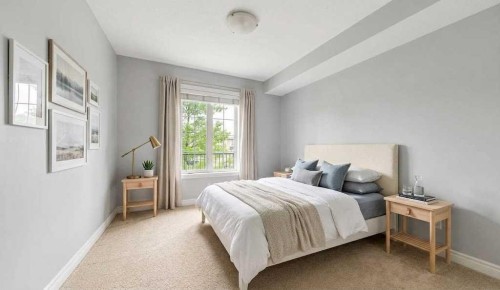 3104-15 Sunset Square, Cochrane, AB - Indoor Photo Showing Bedroom