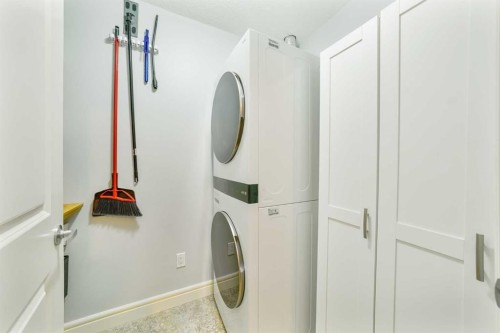 3104-15 Sunset Square, Cochrane, AB - Indoor Photo Showing Laundry Room