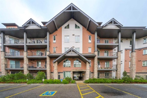 3104-15 Sunset Square, Cochrane, AB - Outdoor With Facade