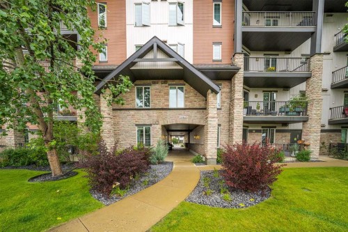 3104-15 Sunset Square, Cochrane, AB - Outdoor With Facade