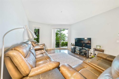 3104-15 Sunset Square, Cochrane, AB - Indoor Photo Showing Living Room