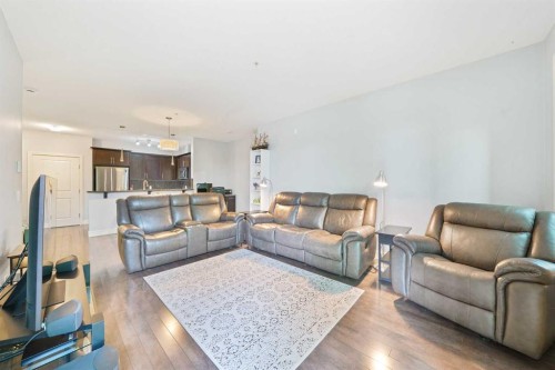 3104-15 Sunset Square, Cochrane, AB - Indoor Photo Showing Living Room