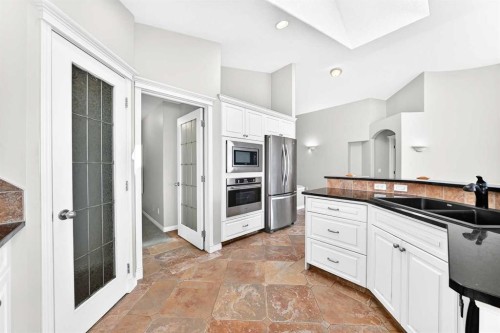 35 Arbour Vista Way Nw, Calgary, AB - Indoor Photo Showing Kitchen With Double Sink