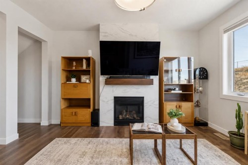 24 Willow Park Point, Cochrane, AB - Indoor Photo Showing Living Room With Fireplace