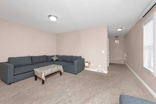 135 Kincora Drive Nw, Calgary, AB - Indoor Photo Showing Living Room