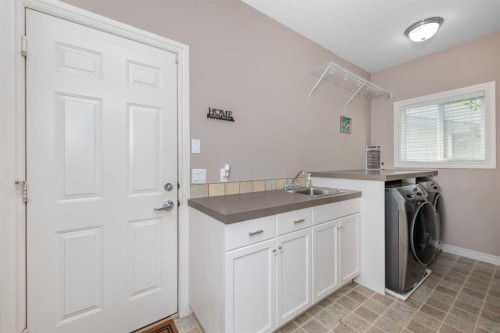 135 Kincora Drive Nw, Calgary, AB - Indoor Photo Showing Laundry Room